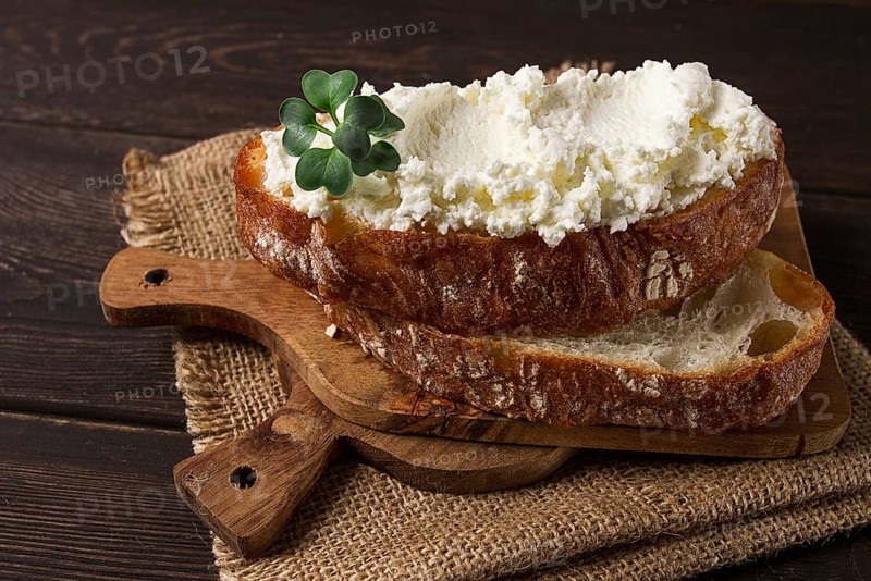 Sandwich, with cream cheese, homemade, on a cutting board, rustic style, no people, selective focus, breakfast