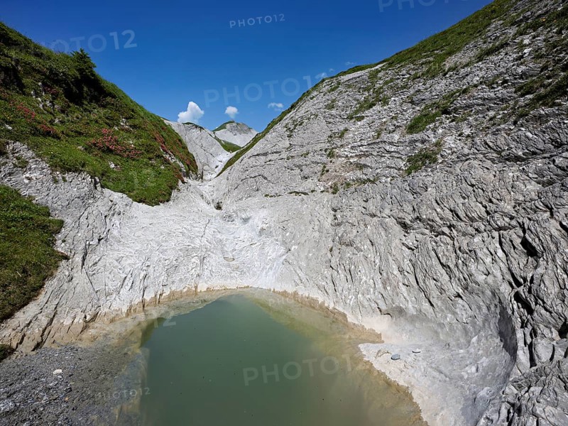 Glacier mill with glacier pots on the Trinser Alp Mora, Trin, Canton Graubünden, Switzerland, Europe