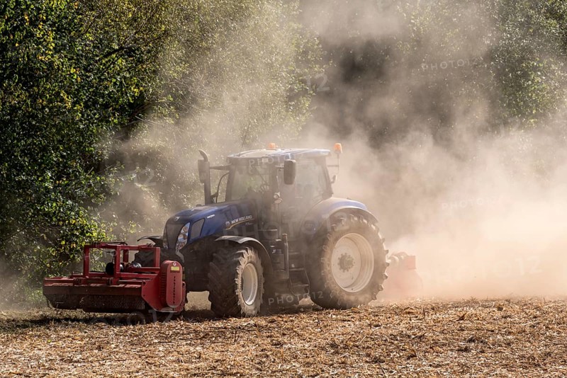 Tractor with plough digging up dried-out soil, large cloud of dust, dust, dry, field, soil, ploughing, digging up, Schwickartshausen, Nidda, Wetterau, Hesse, Germany, Europe