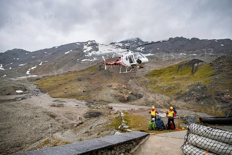 Air rescue operations in the mountains, rescue helicopter, Valais, Switzerland, Europe