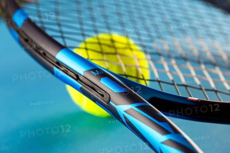 Tennis symbol: close-up of a tennis racket with tennis ball