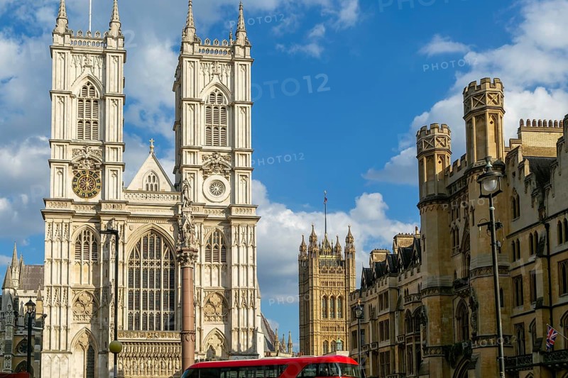 Towers and frontage of Westminster abbey church with Victoria Tower in background, Westminster, London, England, UK