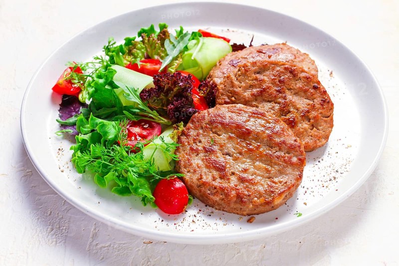 Fried cutlets, turkey, with vegetable salad, top view, no people