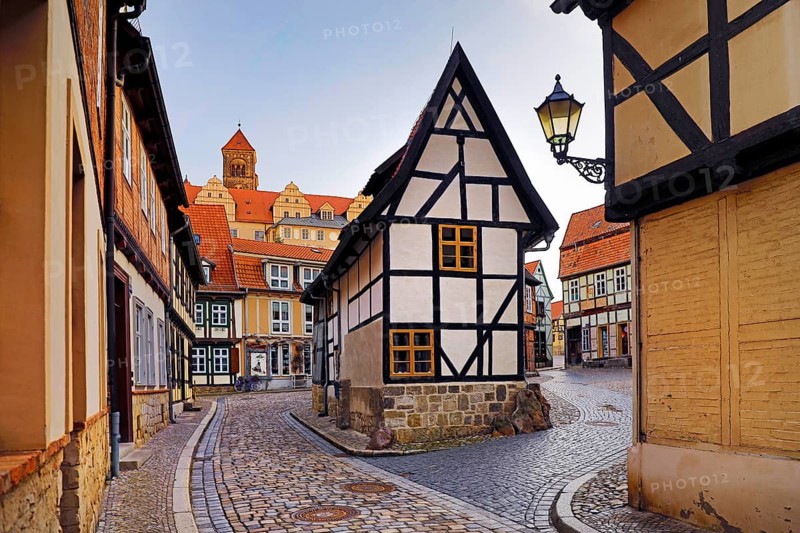 Half-timbered houses in Finkenherd with Schlossberg, alley in the old town centre of the World Heritage town of Quedlinburg, Saxony-Anhalt, Germany, Europe