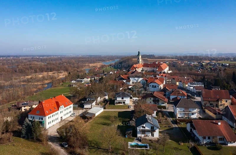 Drone shot, view of the village with Augustinian monastery Reichersberg, Reichersberg, Innviertel. Upper Austria, Austria, Europe