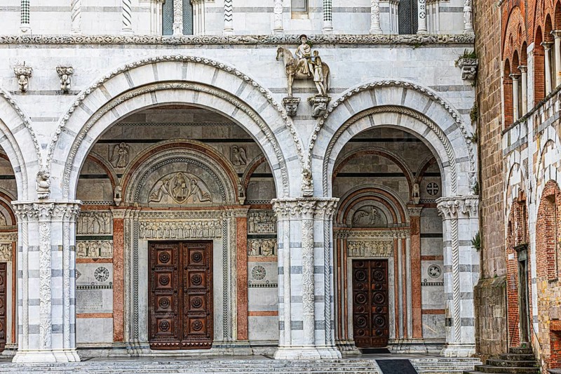 Arched entrance portals of the Cathedral of San Martino, historic city centre, Lucca, Tuscany, Italy, Europe