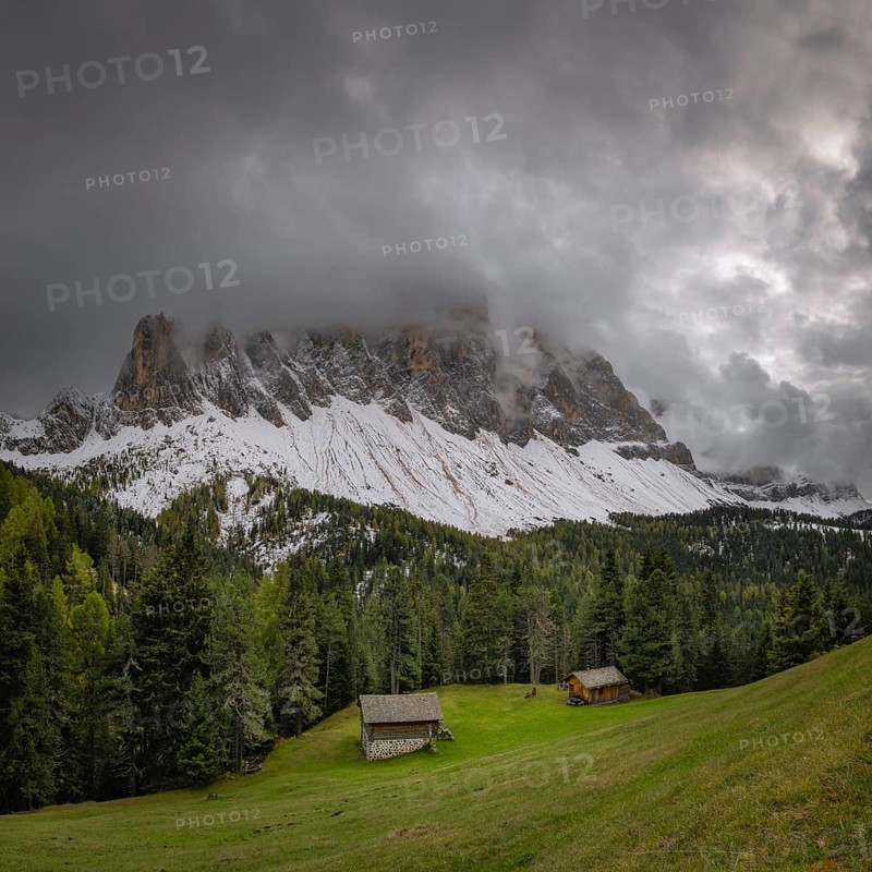 View of a part of the Geisler group in the foreground two mountain huts, Dolomites, snow, Puez-Geisler nature park Park, St. Magdalena, Villnöß, Funes, Villnößtal, South Tyrol, Italy, Europe