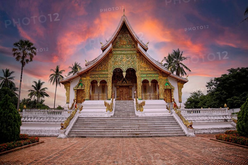 Lovely sunset at a lovely temple in Luang Prabang in summer, Laos, Asia