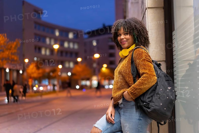 Portrait of black ethnic girl smiling early in the morning going to college on back to school