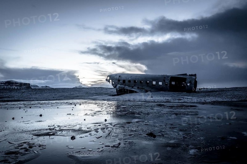Plane wreck, crahsed plane on frozen Solheimasandur beach in winter with snow in Iceland