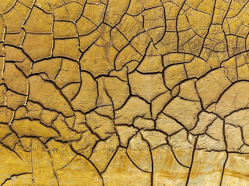 Mineral-rich cracked earth at the bank of the Rio Tinto (Red river), aerial view, drone shot, Huelva province, Andalusia, Spain, Europe