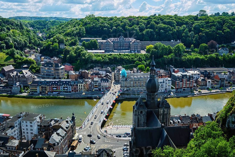Aerial view of Dinant town, Collegiate Church of Notre Dame de Dinant, River Meuse and Pont Charles de Gaulle bridge from Dinant Citadel. Dinant, Belgium, Europe