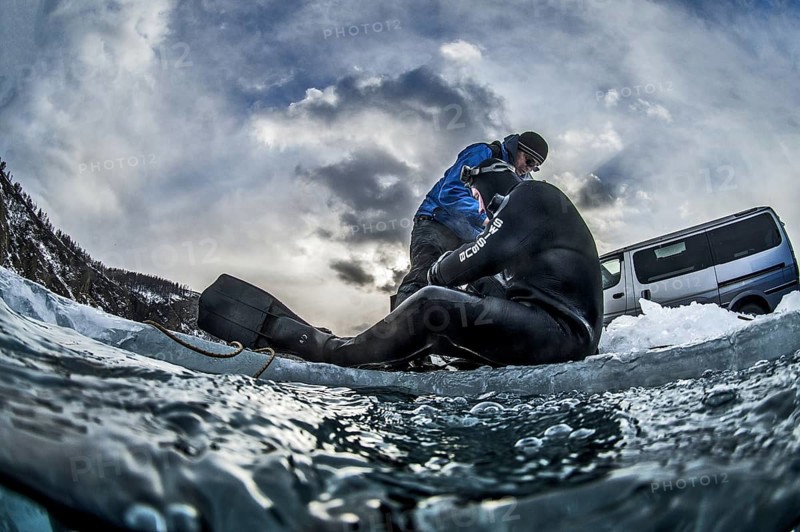 Scuba diver on the ice, Lake Baikal, Olkhon Island, Pribaikalsky National Park, Irkutsk Province, Siberia, Russia, Europe