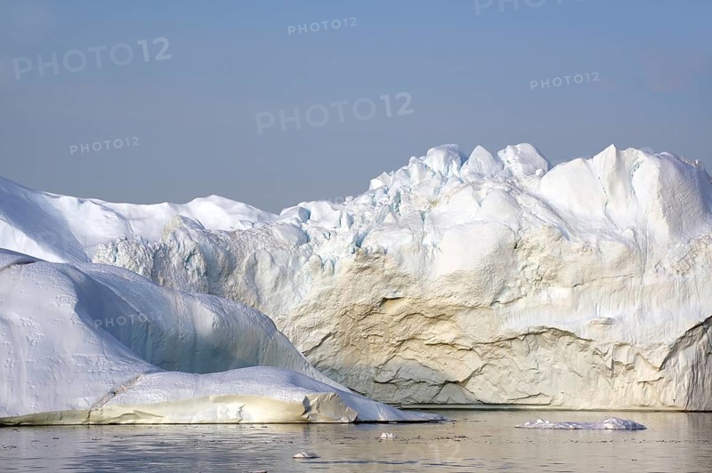 Giant iceberg in the glow of the midnight sun Disko Bay, Ilulissat, Arctic, Greenland, Denmark, North America
