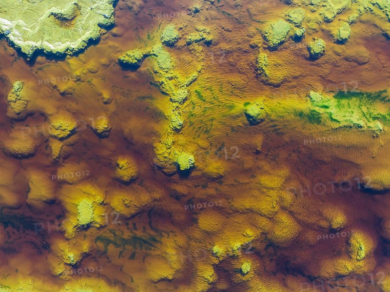 Detail of the Rio Tinto (Red river) with its reddish hue due to oxidised iron minerals and other mineral-rich deposits in its water, aerial view, drone shot, Huelva province, Andalusia, Spain, Europe