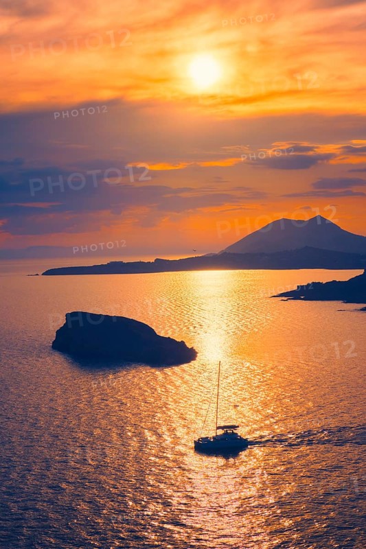 Aegean Sea with Greek islands view on sunset with yacht in sea. Cape Sounion, Greece, Europe