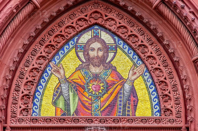 Musical depiction of Jesus Christ in the pointed arch of the main portal of the Church of the Sacred Heart in Freiburg im Breisgau, Baden-Württemberg, Germany, Europe