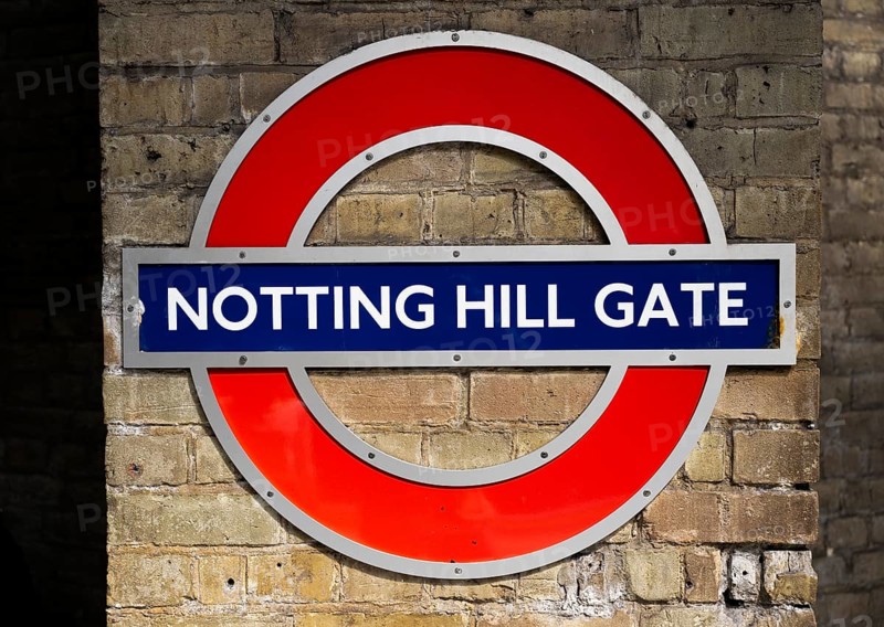 Sign on brick wall, Notting Hill Gate underground station, SLondon, England, Great Britain