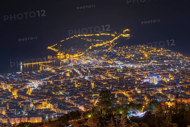The lights of the city of Alanya on the Turkish Riviera glow in the evening, Alanya, Antalya, Turkey, Asia