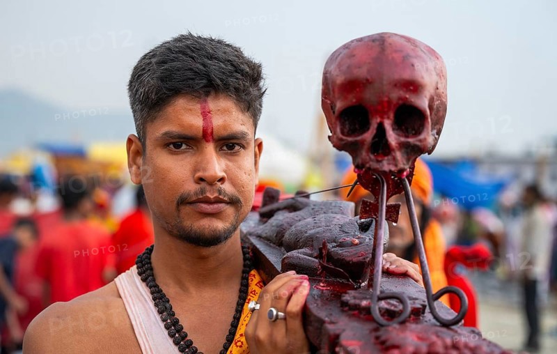 A Hindu priest arrives awith a human skull on the bank of Brahmaputra river on Ashoka Ashtami Festival during Chaitra Navratri on April 5, 2025 in Guwahati, India, Asia