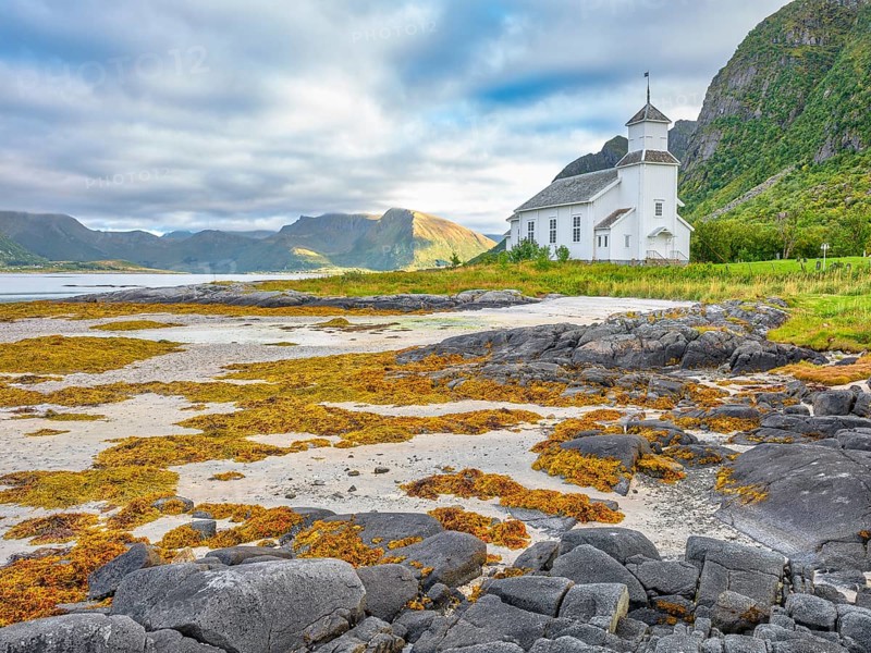 Gimsøy church with beach and seaweed, Gimsøy, Lofoten, Norway, Europe