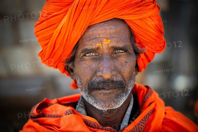 Man with orange turban and yellow bindi on his forehead, portrait, Chittorgarh Fort, Chittorgarh, Rajasthan, India, Asia