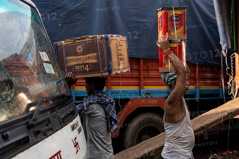 GUWAHATI, INDIA - MAY 1: Labourers carries goods in a wholesale market, in Guwahati, India, on May 1, 2025. May Day or Workers Day is a global holiday celebrated on May 1st to honor workers and their contributions, Asia