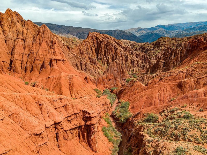 Eroded mountain landscape, canyon with red and orange rock formations, aerial view, Konorchek Canyon, Chuy, Kyrgyzstan, Asia