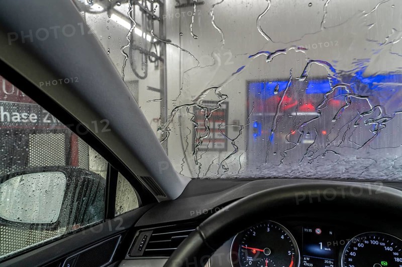 Car in an automatic car wash, car wash tunnel