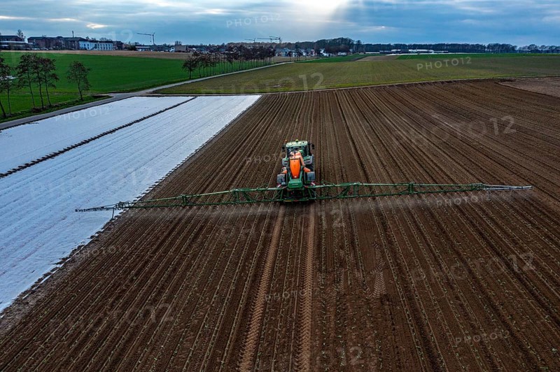 A field is treated with pesticides