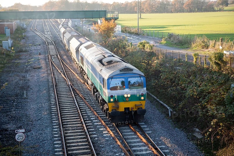 Diesel locomotive freight train on the West Coast mainline at Woodborough, Wiltshire, England, UK