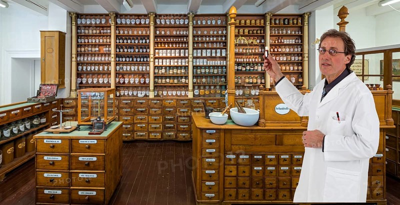 Historic pharmacy with pharmacist and bottle in hand