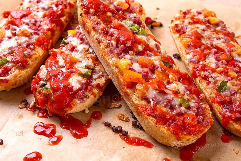 Pizza on a baguette, top view, close-up, no people, fast food, street food