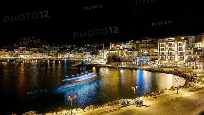 Harbour at night with illuminated buildings, lights reflected in the calm water, Pigadia, town and harbour, Pigadia Bay, main town, Karpathos, Dodecanese, Greek Islands, Greece, Europe