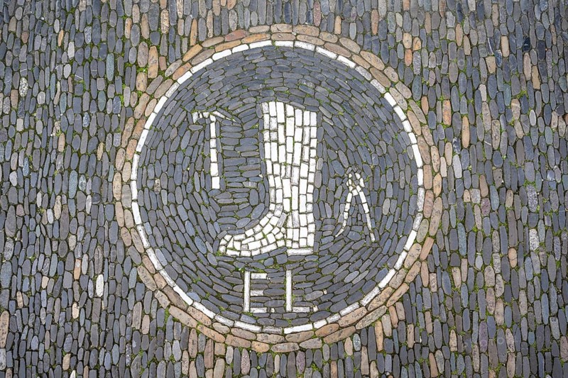 Guild coat of arms of a shoemaker as a floor mosaic in the historic centre of Freiburg, Freiburg im Breisgau, Baden-Württemberg, Germany, Europe