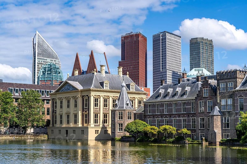 The Mauritshuis, historical art museum at the Binnenhof, seat of the Dutch government, Hofvijver pond, skyline of the city centre at the central station, in the city centre of The Hague, Netherlands