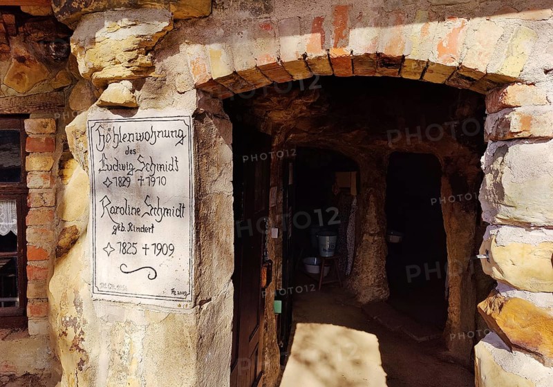 Sign at the entrance to the Schmidthöhle cave, Langenstein cave dwellings, district of Halberstadt, Harz district, Saxony-Anhalt, Germany, Europe
