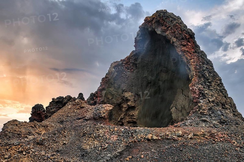 Cave, smoke, volcanic landscape of the Fire Mountains, Montañas del Fuego, Timanfaya National Park, Lanzarote, Spain, Europe