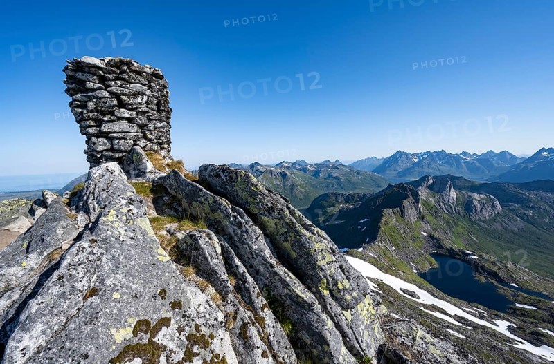 Cairn at the summit of Rundfjellet, view of mountains and fjord landscape, Svolvaer, Nordland, Norway, Europe