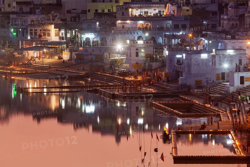 PUSHKAR, INDIA, NOVEMBER 21, 2012: Sacred Puskhar Sagar lake and ghats of Pushkar in twilight in the evening. Pushkar is one of oldest existing cities of India & important pilgrimage site for Hindus