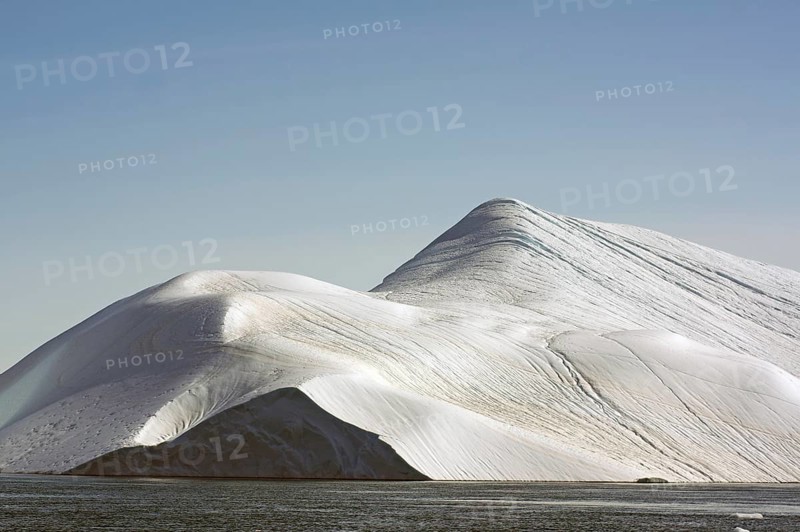 Giant iceberg in the glow of the midnight sun Disko Bay, Ilulissat, Arctic, Greenland, Denmark, North America