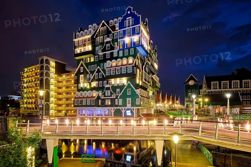 ZAANDAM, NETHERLANDS, MAY 21, 2018: Inntel Hotel in Zaandam illuminated at night. Design of 12-storey tall building opened in 2009 is the result of stacking a series of traditional Dutch houses