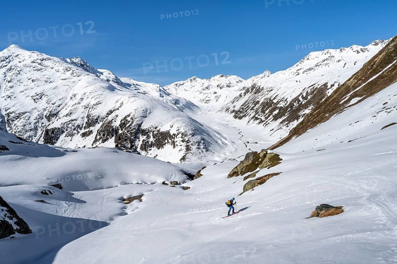 Acitourers climbing up to the Grialetsch Scharte, view of the Funtauna Valley in winter, Graubünden Haute Route, Albula Alps, Rhaetian Alps, Graubünden, Switzerland, Europe