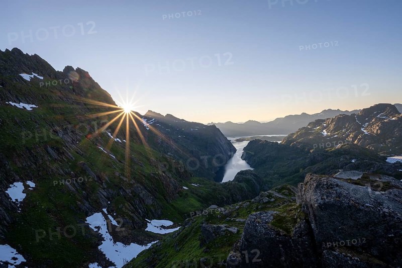 Picturesque mountain landscape at sunrise with sun star, fjord Trollfjord and Raftsund, hike to Trollfjord Hytta, Lofoten, Nordland, Norway, Europe