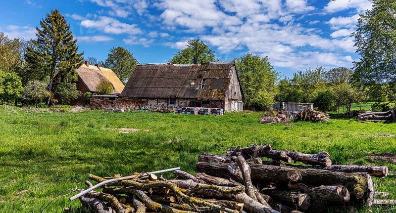 Abandoned and derelict farmhouses on undeveloped land in Rügen, Mecklenburg-Vorpommern, Germany, Europe