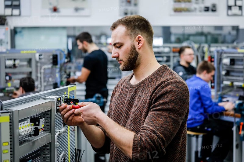 Remscheid, North Rhine-Westphalia, Germany - Trainees in electrical professions, an industrial electrician assembles a circuit, Vocational Training Centre of the Remscheid metal and electrical industry. - FOR EDITORIAL USE ONLY!