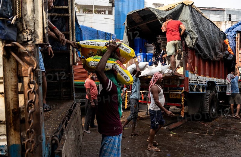 GUWAHATI, INDIA - MAY 1: Labourers carries goods in a wholesale market, in Guwahati, India, on May 1, 2025. May Day or Workers Day is a global holiday celebrated on May 1st to honor workers and their contributions, Asia