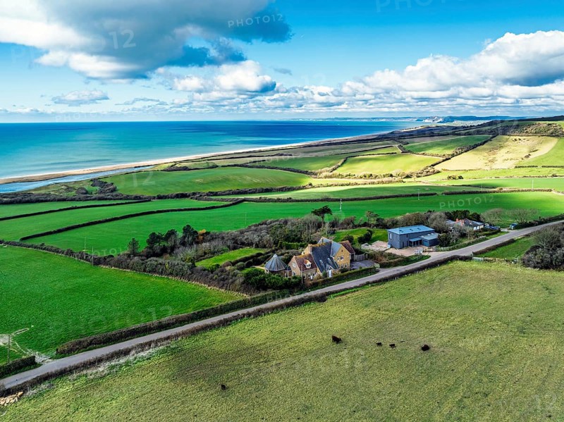 Farms over Swyre and West Bexington from a drone, West Bexington Nature Reserve, S W Coast Path, Dorchester, Dorset, England, United Kingdom, Europe