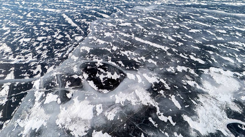 Frozen lake in early winter. Region of La Mauricie. Province of Quebec. Canada