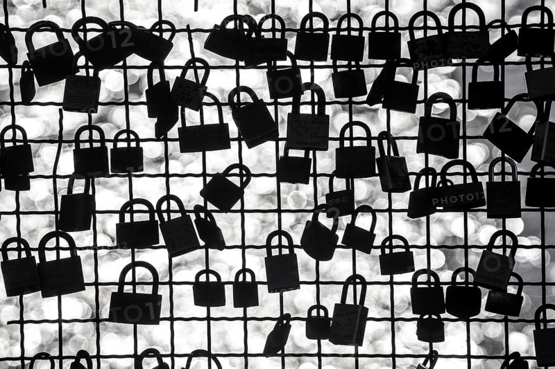 Padlocks, so-called love locks on a fence, vantage point in Wesel am Rhein, North Rhine-Westphalia, Germany, Europe